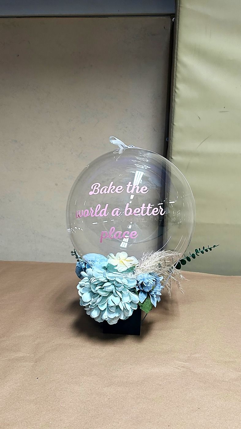 Bubble balloon with a floral arrangement inside